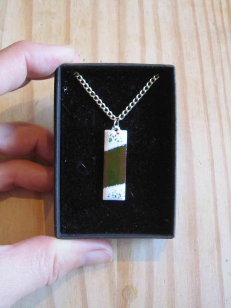 green enamelled rectangular necklace with white ends