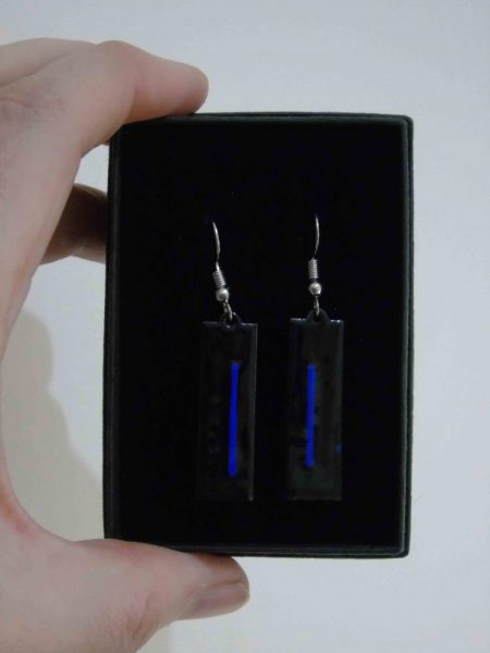 black rectangular earrings with blue stripes