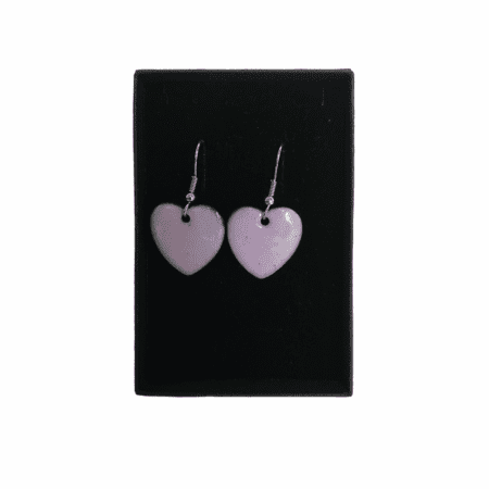 Pale pink overfired enamelled copper heart shaped earrings with allergy safe surgical steel hooks in their presentation box