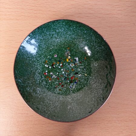 Green enamelled bowl or dish with tiny spots and colourful bigger spots.
