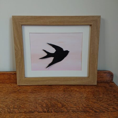 Swallow, swift or house martin wall hanging or picture with enamelled copper bird silhouette mounted in a frame with a watercolour background