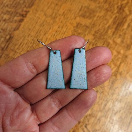 Rhomboid or slightly uneven rectangular earrings in pale blue with pale and mixed coloured dots. Surgical steel ear hooks